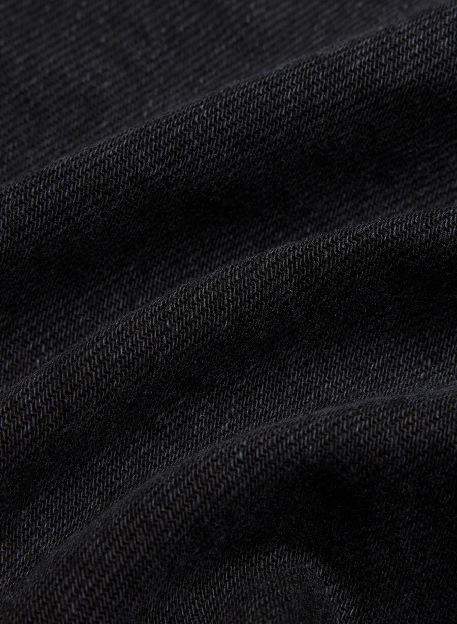 denim forum 90-tallets ricci-dongerskjørt svart eyeliner