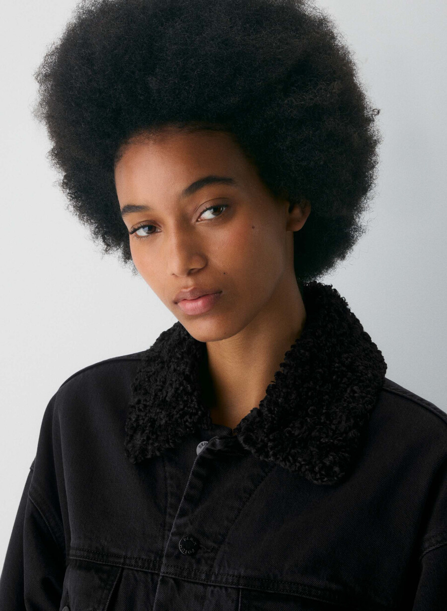 denim forum 90-tallets vintage sherpa-dongerijakke svart eyeliner